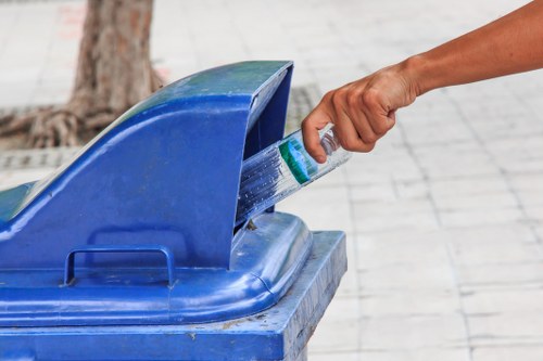 Workers managing builders waste on site